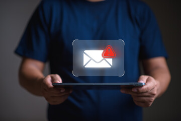 Spam email and virus  concept, man using tablet with spam email icon,  scammer,  malware, virus.