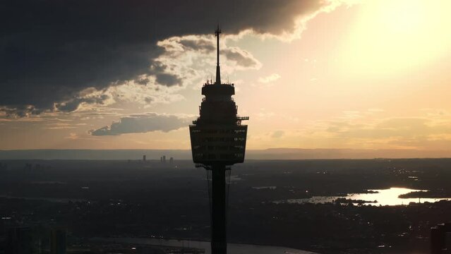 4K Drone aerial point of view of Sydney Tower with cityscape skyscrapers skyline financial office building and Sydney harbour in NSW, Australia. Landmark famous place and commercial business concept.