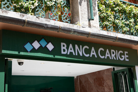Banca Carige logo brand and text sign bank branch signage on wall facade Cassa di Risparmio di Genova e Imperia Italian bank
