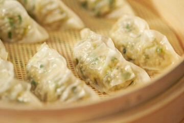 Meat dumplings in wooden steamer