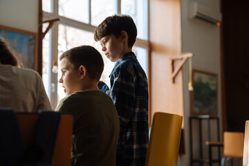 Portrait of two boys in classroom