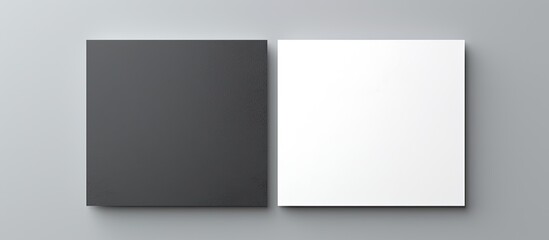 white and black business cards on a grey background. copy space available on the cards for writing.