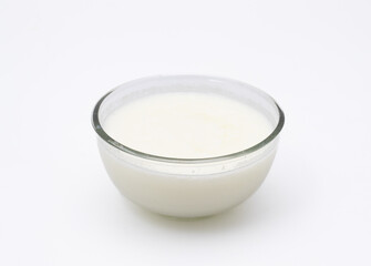 Home made yogurt on glass bowl on white background isolated