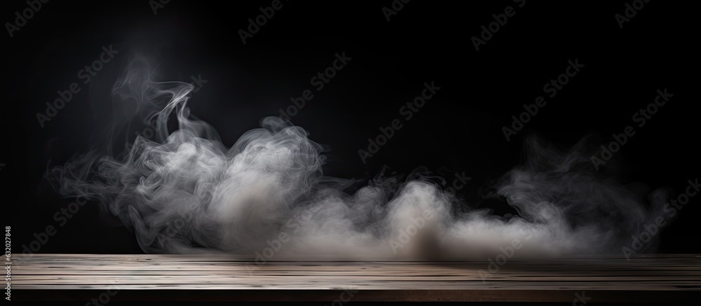 Poster an unoccupied wooden table is shown on a dark background with smoke rising, providing an empty space