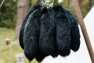 Fur products animal tails, sale of medieval fur ornaments in the open air