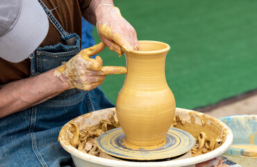 Clay craftsman sculpts crockery