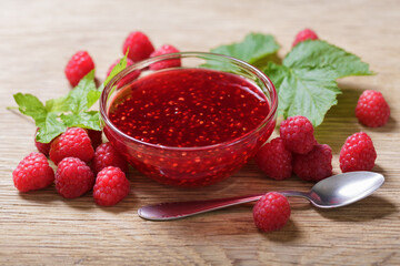 Bowl of raspberry jam with fresh fruits