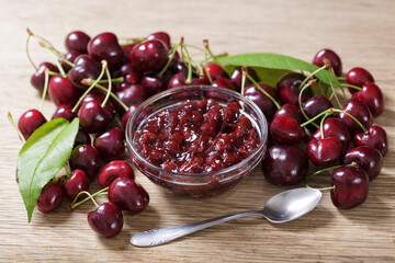 Bowl of cherry jam with fresh fruits