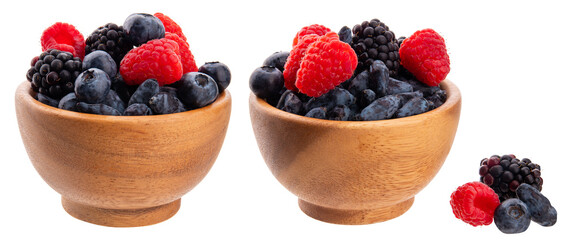 Wild berries in a wooden bowl isolated on transparent background png. Fresh ripe raspberries,...
