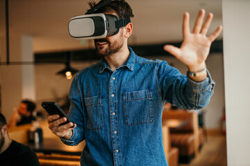 Man using the phone and virtual reality. Education and fun