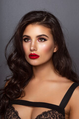 Beauty portrait of a gorgeous young woman with brunette hairstyle and makeup. Closeup front portrait.