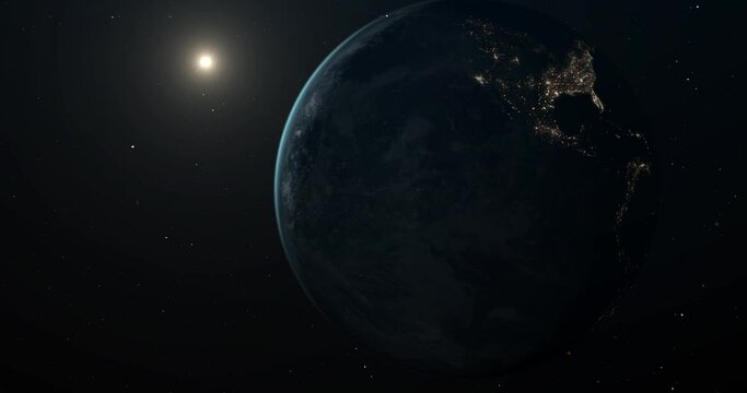 Planet Earth in open space, with a clearly visible terminator line dividing the planet into the bright daylight side and the dark nighttime side.