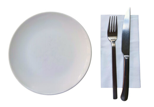 White empty plate, metal knife, fork and napkin on isolated background. Cutlery for serving. Top view.