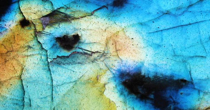 Labradorite iridescence with beautiful rainbow color. macro detail texture background. close-up polished semi-precious gemstone.