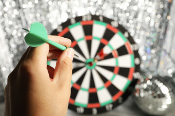 Darts hitting the target game at the party.