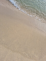 Soft beautiful ocean wave on sandy beach. Background