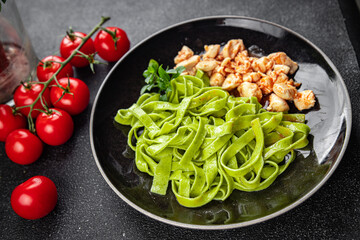 green pasta tomato sauce tagliatelle chicken meat vegetable food healthy meal snack on the table copy space food background rustic top view