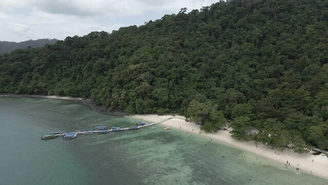 Tourist tour boats at pier on Pulau Beras Basah island, Langkawi