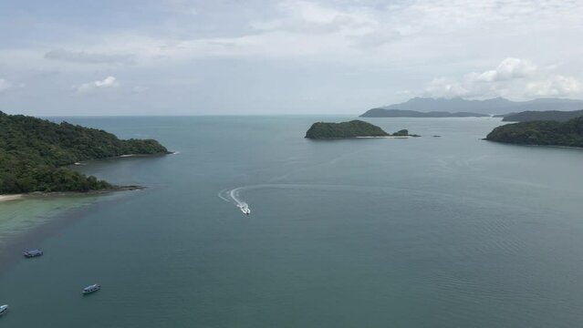 Pan across Strait of Malacca at Langkawi Malaysia to tour boat pier