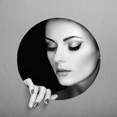 Conceptual beauty portrait of beautiful young woman. Perfect Manicure.  Cosmetic Eyeshadows. Fashion photo. Black and white