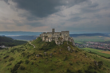 Fototapeta na wymiar Aerial view of Spis castle with stormy clouds in the background
