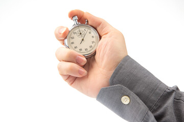 hand with a mechanical analog stopwatch on a white background. Time part precision. Measurement of the speed interval