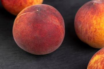 ripe delicious and fresh peaches of a red hue