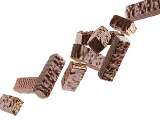 Chocolate wafers with nuts fly in space forming a chain. Isolated on white