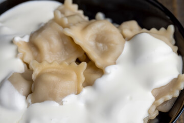 Sour cream covered dumplings with meat