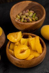 ripe yellow apricots on the table close-up