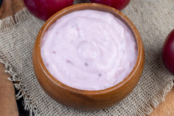 flavored pink yogurt with ripe and sweet plum