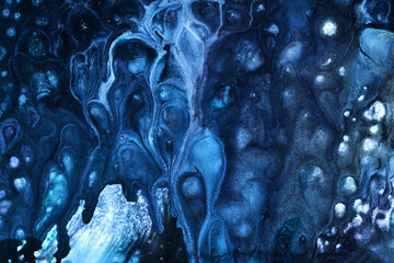 Exclusive beautiful pattern, abstract fluid art background. Flow of blending blue paints mixing...