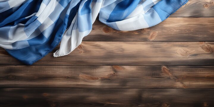 Rustic background with bavarian white and blue fabric on old wooden plank