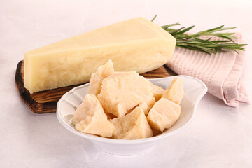 Chopped Italian hard parmesan cheese