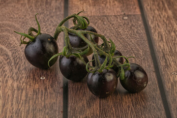Ripe tasty black cherry tomato