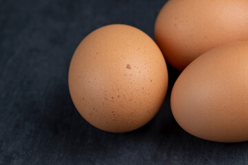 A clean whole orange chicken egg close-up on the table