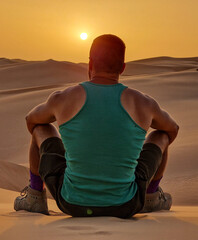 Man looking at the sunrise in Mauritania 