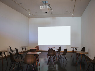 BlankProjector wall Mock up screen Presentation interior room with  Table and seats