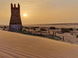 Mauritania mosque at sunset in the desert 