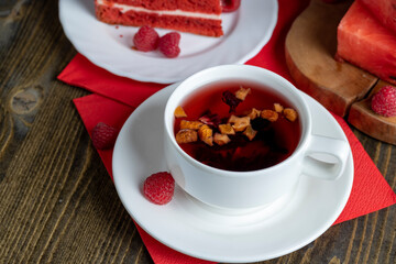Red raspberry tea with pieces of fruit and berries
