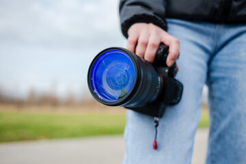 DSLR camera with broken lens filter. Cracked photo-filter