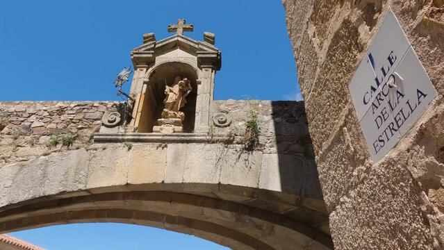 Ancient charm: Arco de la Estrella in C&aacute;ceres Old Town, Spain