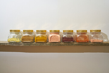 several spices in glass jars