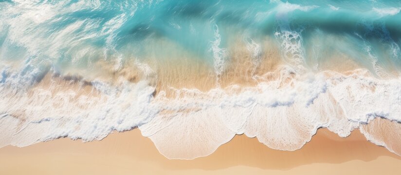 shows an aerial view of a sandy beach with clear light blue water, waves, and sunlight. It represents a summer vacation background with space for text and conveys a natural beauty spa concept.