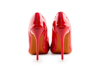 a pair of red women's high-heeled shoes on white background