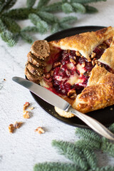 Baked brie cheese and cranberry puff pastry. Homemade puff pastry baking, sweet-savory taste, gourmet appetizer.