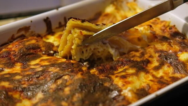 Hot Lasagna. Traditional homemade lasagna made with minced beef bolognese and bechamel sauce. Freshly baked meat lasagna with lots of melted cheese and pasta. Italian food. Close-up. Menu, recipe.