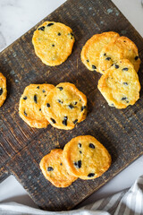 Italian style round shortbread cookies with black olives and Parmesan cheese