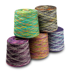 composition of bobbins with woolen threads, yarn for knitting close-up on a white background