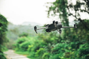 Drone flying in spring forest